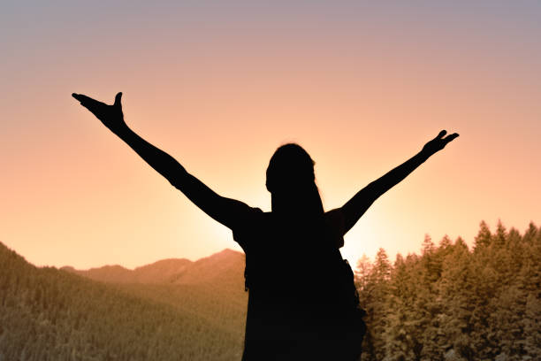 istock Woman enjoying beautiful sunset during her hike. 2120853330