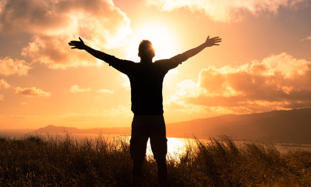 istock Men feeling free, joyful and enjoying beautiful sunrise. 2120859532