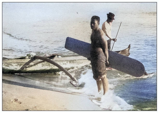 Antique black and white photograph of people from islands in the Caribbean and in the Pacific Ocean; Cuba, Hawaii, Philippines and others: Surf board, Hawaii, 1898