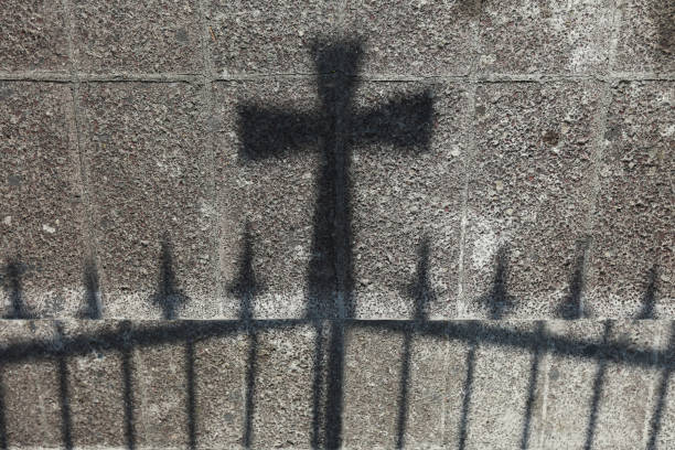 istock Figure of the cross in a shadow 2120909498