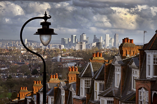 The rooftops of North London looking from Muswell Hill towards distant towers of Canary Wharf