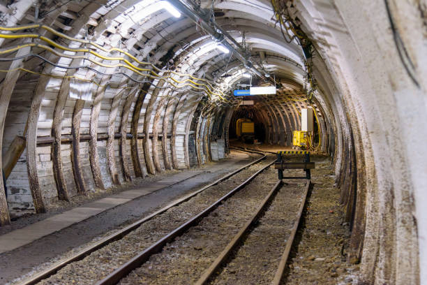 istock Coal mine tunnel with rail tracks 2121011057