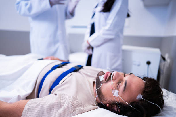 istock Patient sleeping in a medical clinic doing polysomnography 2121066217