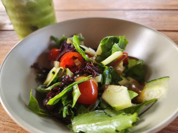 istock Healthy Green Salad with Tomatoes and Cucumbers 2121077835