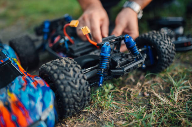 istock Selective focus low angle frame toy care repair replacing batteries outdoors. 2121104878