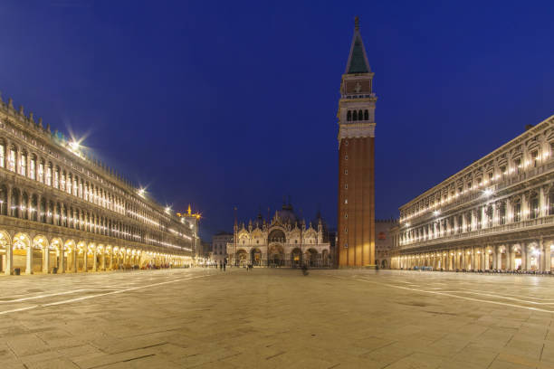 istock An empty illuminated San Marco square with the bell tower and the cathedral at blue hour on a winter evening, Venice, Veneto, Italy 2121132540