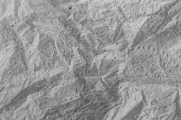 Wrinkled toilet paper texture background grey retro.