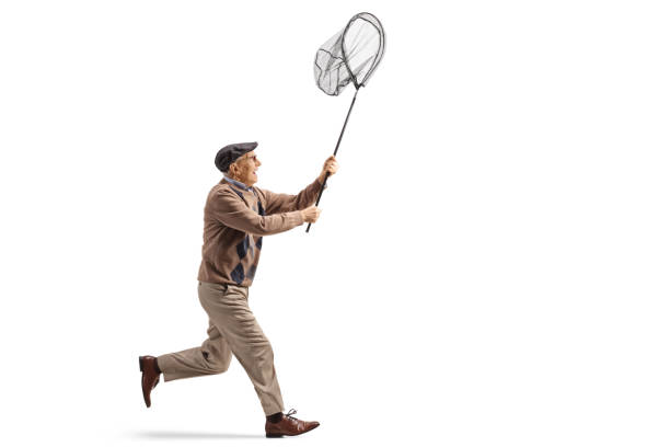 istock Elderly man running with a catching net 2121214844