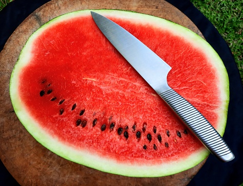 Cutting Watermelon fruit - food preparation.