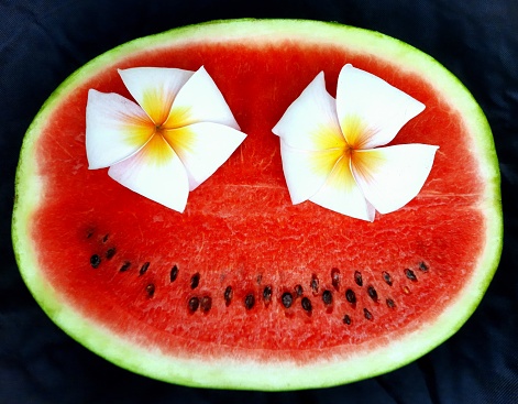 Smiling Frangipani flowers and Watermelon.