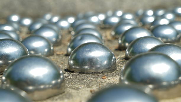 istock Scratched metal sphere tile floor 2121268203