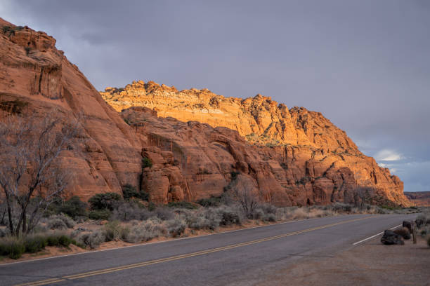 istock Road Through Snow Canyon Sun Shining on Mountain 2121279325