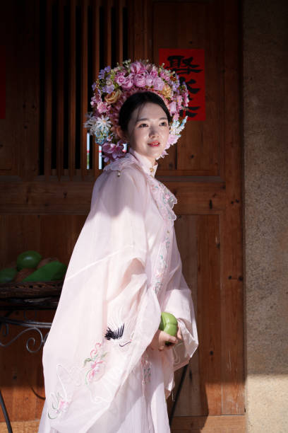 istock Woman experiencing traditional Chinese clothing 2121281184
