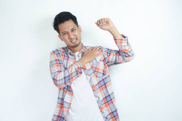 istock Adult Asian man touching his left shoulder with pain expression 2121359817
