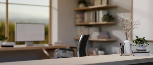 istock A close-up image of a table with decor in a modern minimalist home office with a computer desk. 2121387335