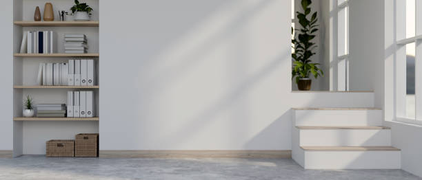 istock A modern minimalist white home corridor features two layers of flooring, shelves with decor. 2121387502