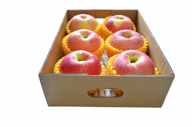 beautiful pink apple in the box on white background