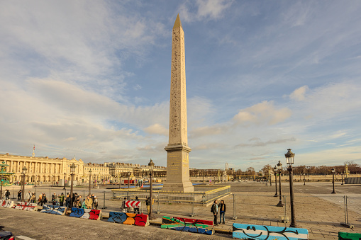 View of Obelisk of Luxor from the top deck of a hop-on hop-off Tootbus in Paris, France, on Christmas Eve 2023.  HDR encoded