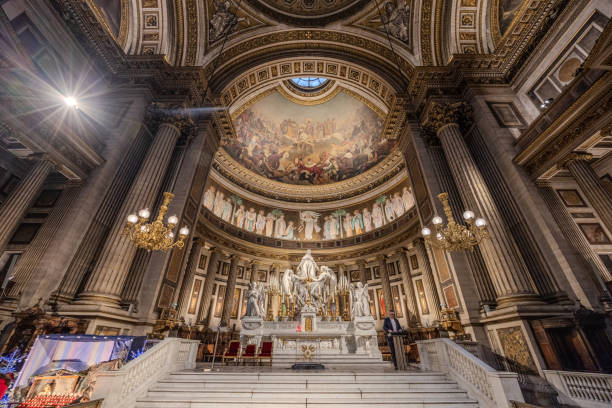 The altar and sanctuary of Church of the Madeleine in Paris, France, on Christmas Day 2023.  HDR encoded