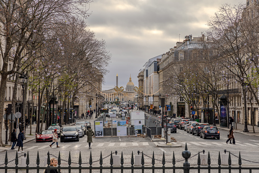 View of Obelisk of Luxor, Palais-Bourbon, and the golden dome of Hotel Des Invalides from the front steps of Church of the Madeleine on Christmas Day 2023.  HDR encoded