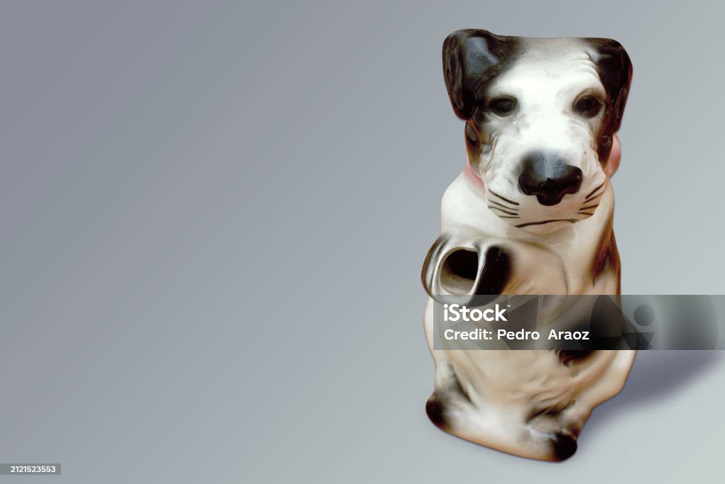 Vintage Terrier Teapot,Terrier that is black and white with a pink bow,on grey background Antique Stock Photo Vintage Terrier Teapot,Terrier that is black and white with a pink bow,on grey background Antique Stock Photo