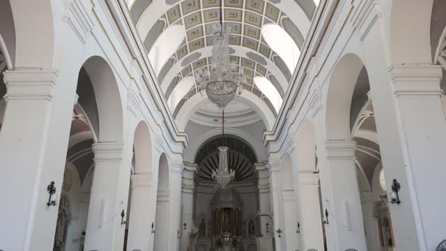 Tilt Down View From White Ceiling Of Cathedral of Santa Marta also known as the Minor Basilica In Colombia