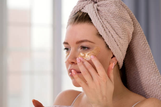 istock Applying eye patches in skincare routine. 2121560213