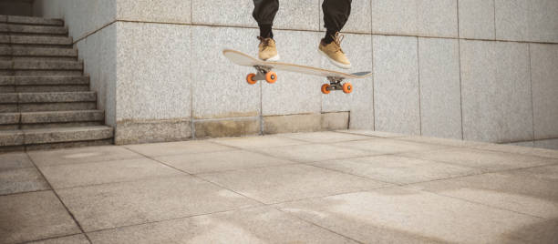 istock Skateboarder skateboarding in modern city 2121576065