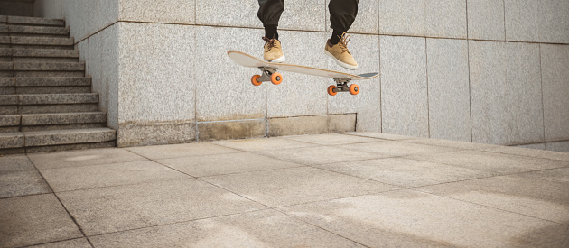 Skateboarder skateboarding in modern city