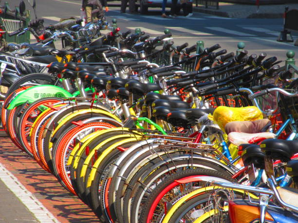 There are a number of public bike companies across Mainland China, including MoBike, OFO,  and HelloBike. You have some that are dock-free, meaning you can park them almost anywhere, and others you can pull from and return to docking stations. For most, you can find their location on a map using their respective apps, then scan the bike's QR code to unlock them. Sometimes, bikes may end up in bicycle graveyards if they are not parked or returned properly. Nevertheless, public bikes are a very convenient way of getting around towns in China.