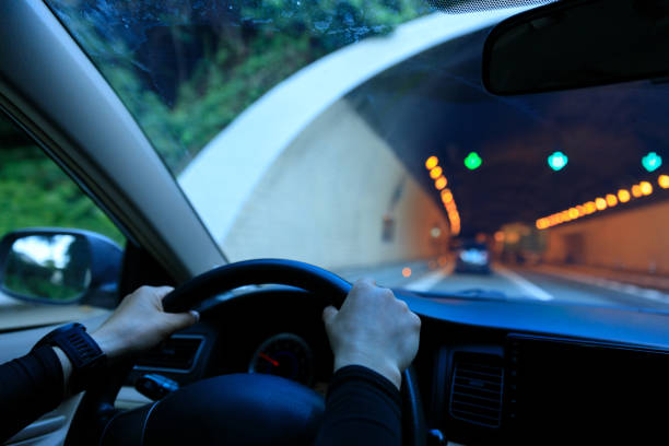 istock People driving car on city road 2121665685