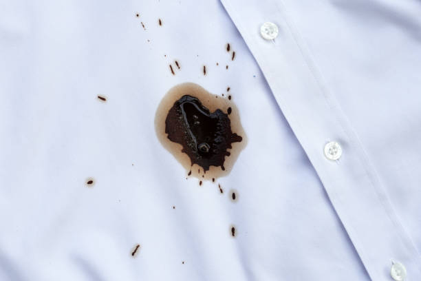 istock Dirty coffee stains on white clothes 2121754393