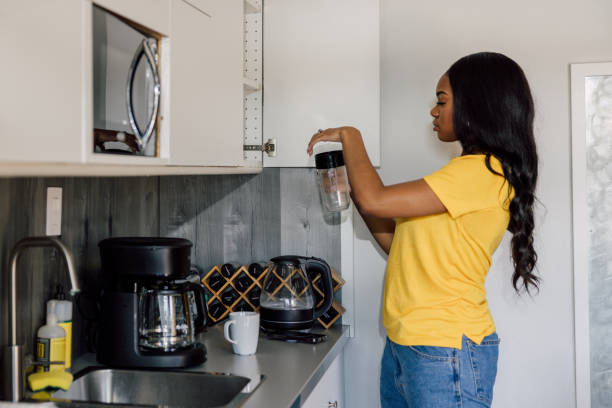 istock Morning routine, young woman preparing breakfast 2121791826