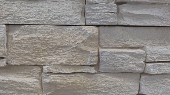 facade beige stone old used brick white wall texture background