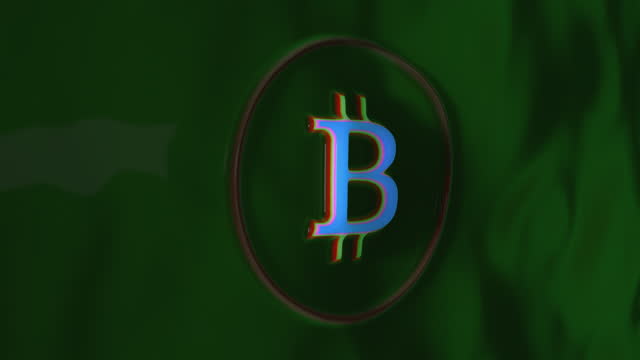 Abstract Bitcoin logo embossed on velvet green fabric and colored in blue, red, green, pink. The fabric sways in the wind.