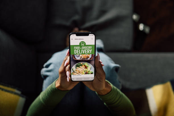istock Woman using meal delivery mobile app 2121832784