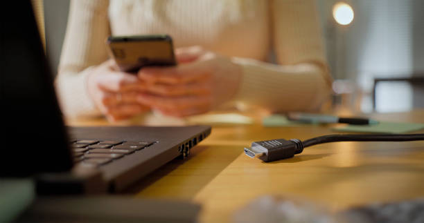 istock Laptop and charger on desk 2121843947