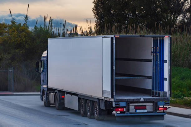 istock Refrigerated truck with mobile insulating panels inside for double temperature loads, rear view. 2121872347