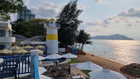 Bangsaray Pattaya Thailand 28 February 2024, A scenic beachfront view adorned with colorful umbrellas and beach chairs, inviting you to relax under the sun and enjoy the soothing sound of the waves crashing against the shore.