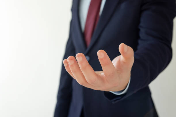 istock Businessman opening his hand 2121883216