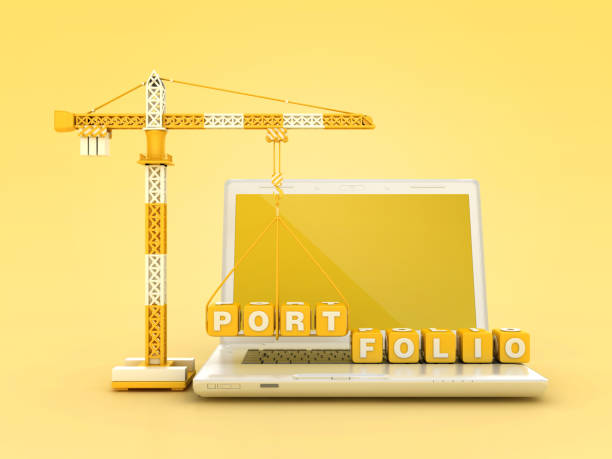 istock PORTFOLIO Blocks with Tower Crane on Computer Laptop 2121891937