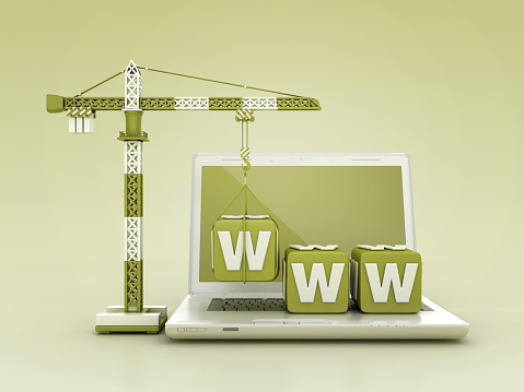 WWW Blocks with Tower Crane on Computer Laptop - Color Background - 3D Rendering