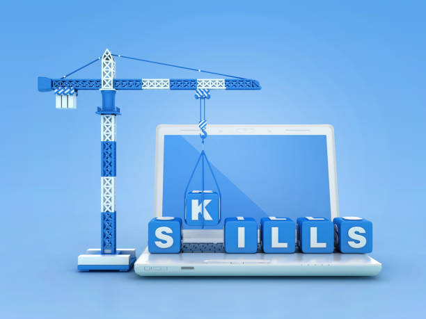 istock SKILLS Blocks with Tower Crane on Computer Laptop 2121892498