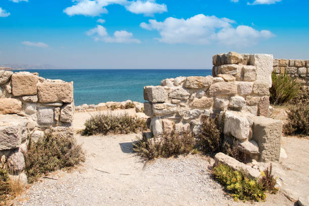 Remains of ancient ruins on Kos island, city of Kefalos, Greece, scene in front of blue ocean and beautiful sky