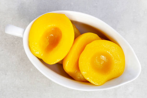 istock Peach halves in syrup. Fruity desserts 2121926741