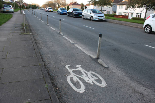 istock UK Cycle lane with white plastic bollards 2121968499