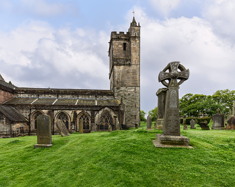 The Church of the Holy Rude stands in solemn grace in Stirling, Scotland, its gothic architecture and Celtic cross tombstones painting a picture of historical reverence