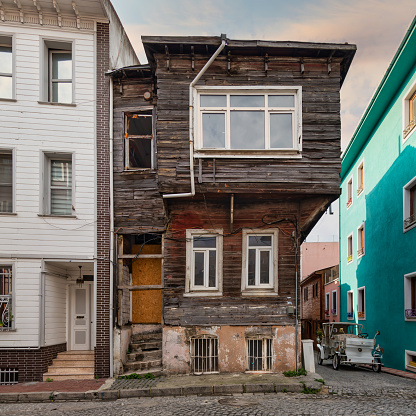 Cobblestone alley, with old ruined wooden house near Sultanahmet square, Fatih district, Istanbul, Turkey, in a summer day