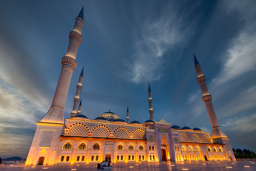 Dusk settles over the Camlica Mosque, with its illuminated minarets piercing the evening sky in Uskudar district, Istanbul, Turkey