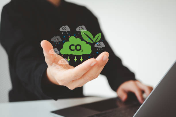 istock Reduce CO2 emissions concept. Climate change to limit global warming and sustainable development and green business. Businessman use laptop with carbon reduction icon on virtual screen. 2122061194